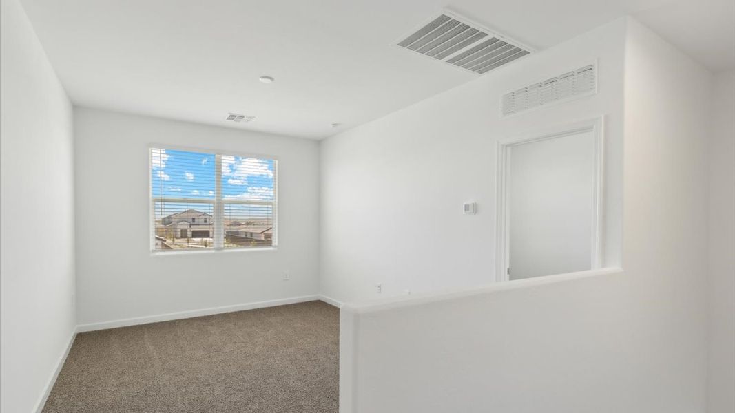 Spacious, unfurnished interior of a new home in Radiance at Superstition Vistas, Apache Junction (Image 27).