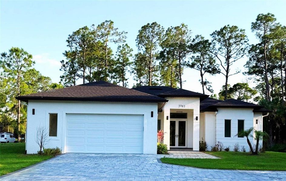 Front exterior of a new home in , Naples, FL, highlighting curb appeal (Image 28).