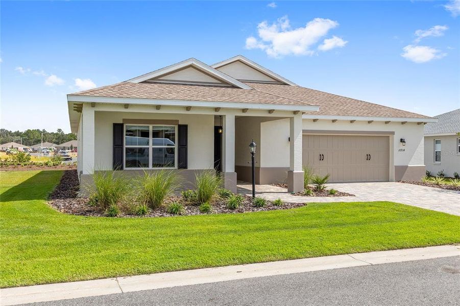 Front exterior of a new home in On Top of the World Communities, Ocala, FL, highlighting curb appeal (Image 2). Front exterior of a new home in On Top of the World Communities, Ocala, FL, highlighting curb appeal (Image 2).