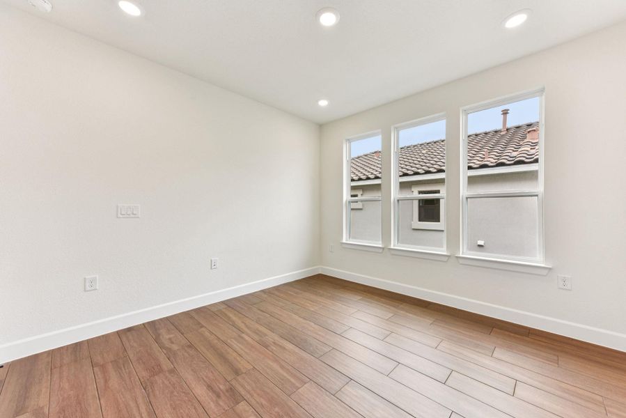 Unfurnished room featuring light wood-style flooring and recessed lighting