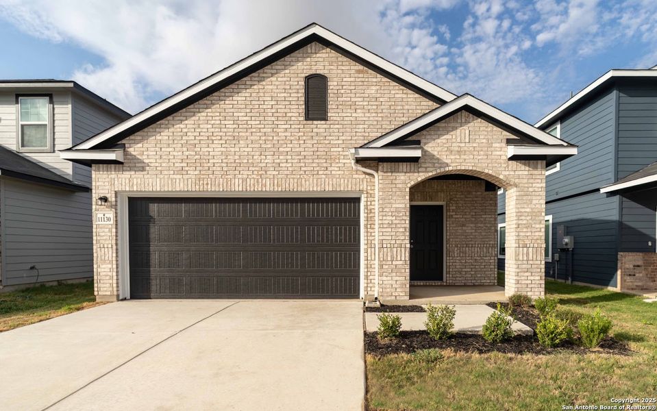 Front exterior of a new home in Katzer Ranch, Converse, TX, highlighting curb appeal (Image 1).