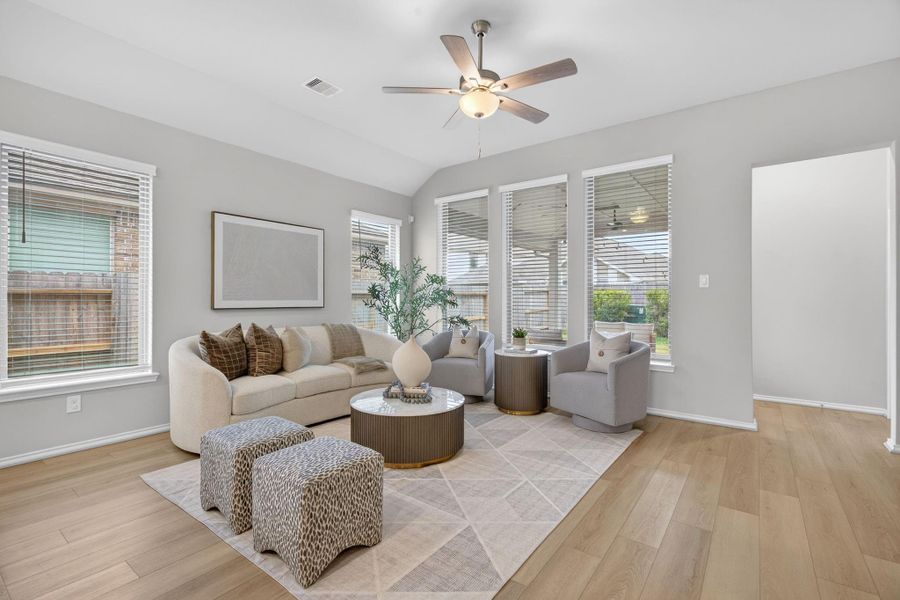 Bright and inviting living room with large windows, creating a cozy yet stylish atmosphere. Bright and inviting living room with large windows, creating a cozy yet stylish atmosphere.