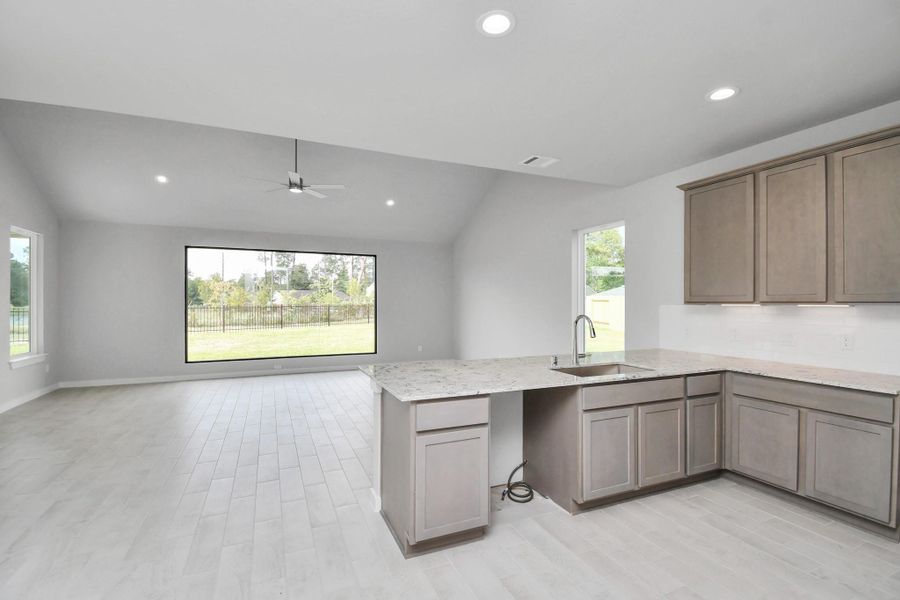 This generously spacious kitchen is a dream realized! Sample photo of completed home with similar floor plan. Actual colors and selections may vary.
