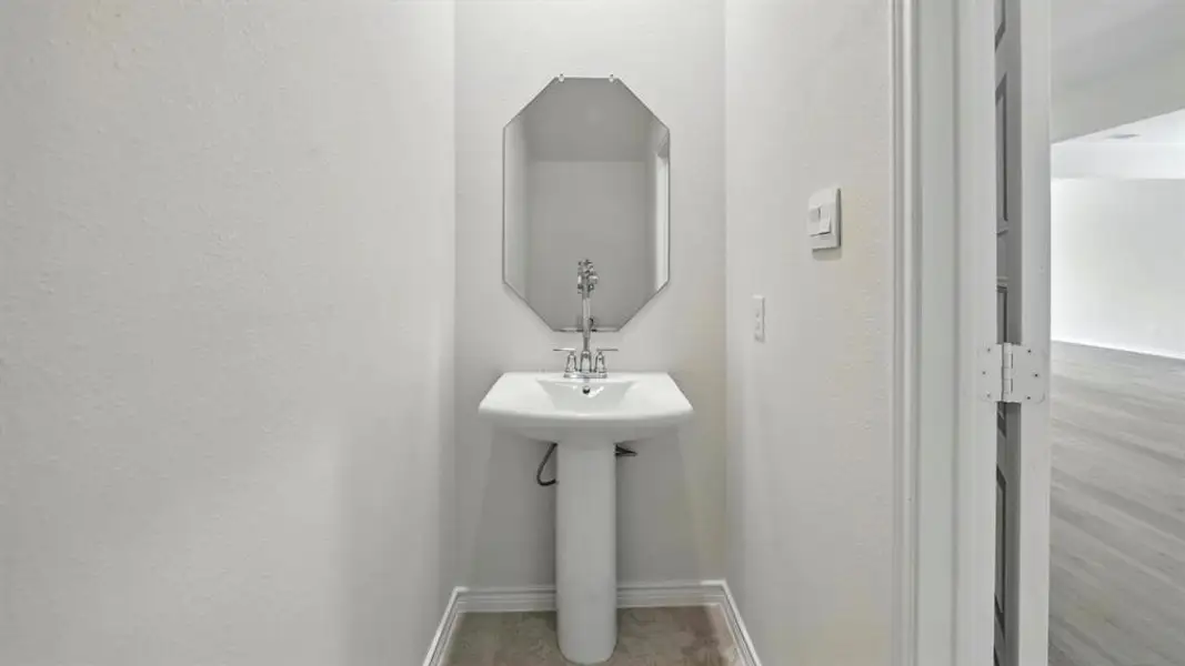 Half bath with baseboards