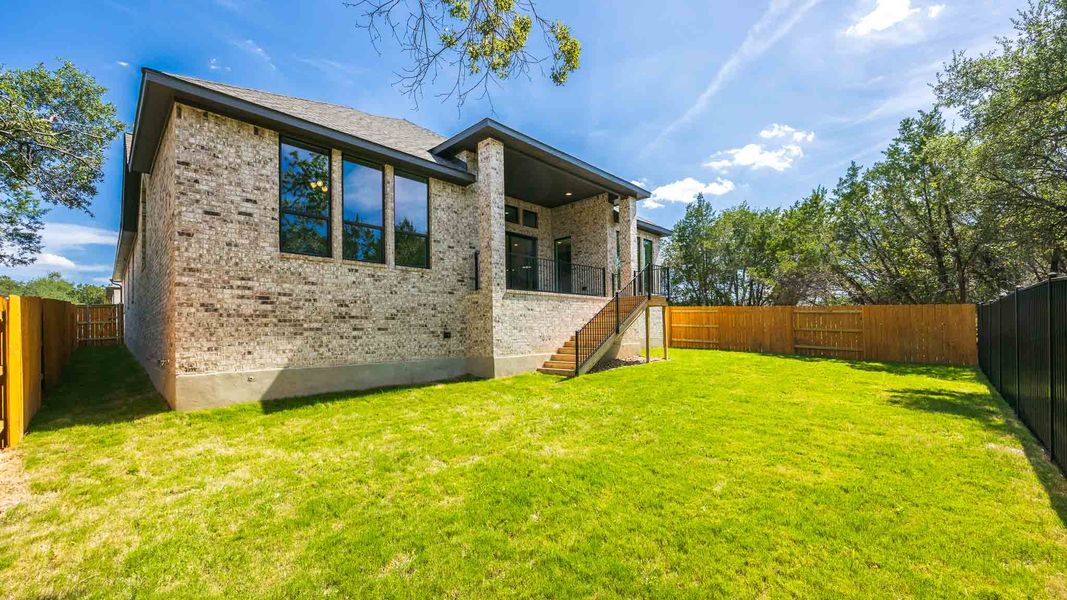 Exterior details and patio area of a home in Parkside on the River West, Georgetown (Image 3).