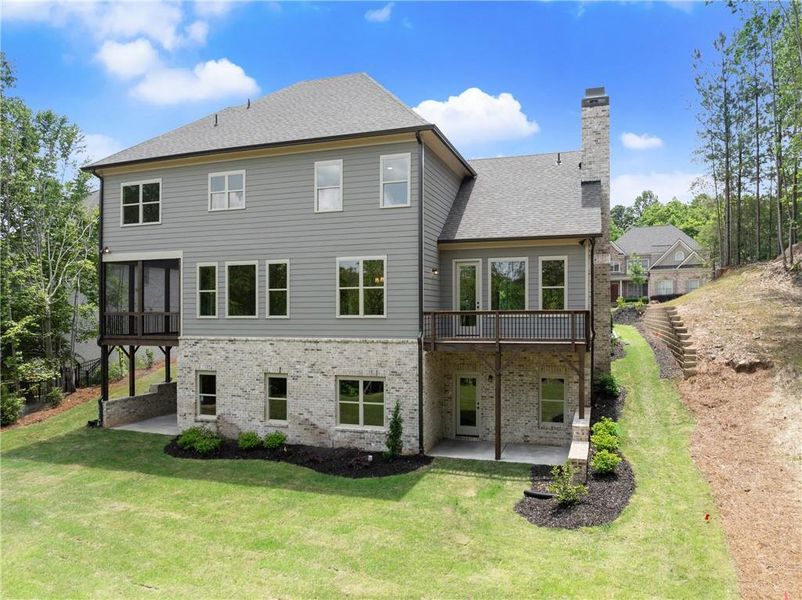 Front exterior of a new home in , Flowery Branch, GA, highlighting curb appeal (Image 26). Front exterior of a new home in , Flowery Branch, GA, highlighting curb appeal (Image 26).