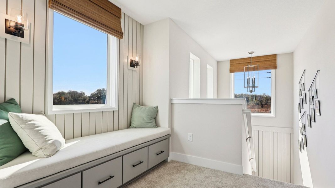 The Mangrove Upstairs Landing with a Cozy Seating Area at Lakeside at Satilla by DRB Homes in Saint Cloud, FL