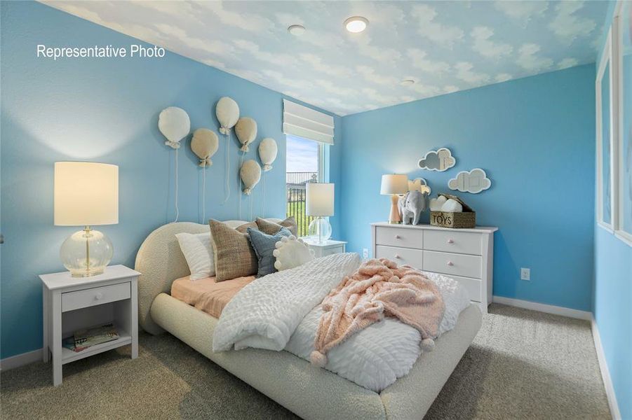 Carpeted bedroom featuring a light blue wall finish, a recessed ceiling light, and a window with white blinds Carpeted bedroom featuring a light blue wall finish, a recessed ceiling light, and a window with white blinds
