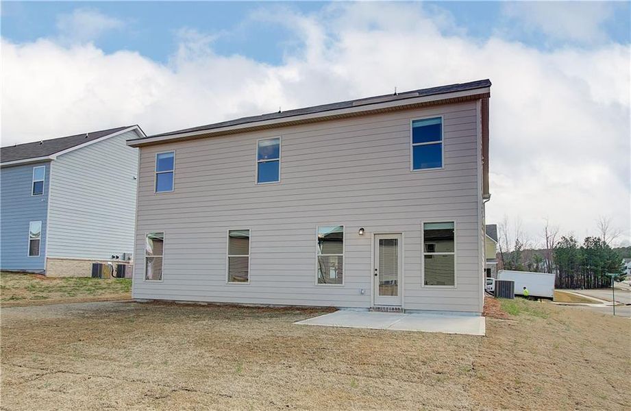 Exterior details and patio area of a home in Berkeley Lakes, Locust Grove (Image 4).
