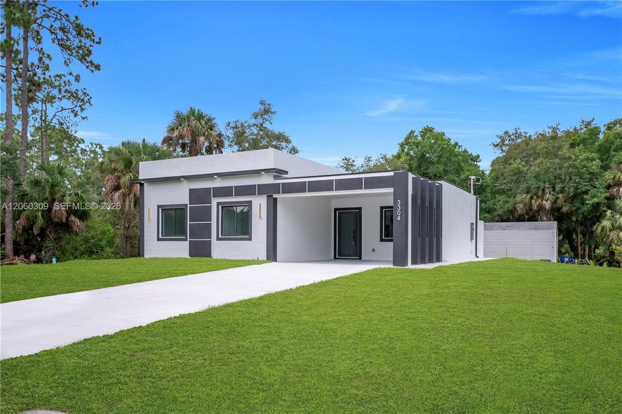Front exterior of a new home in , Lehigh Acres, FL, highlighting curb appeal (Image 25).