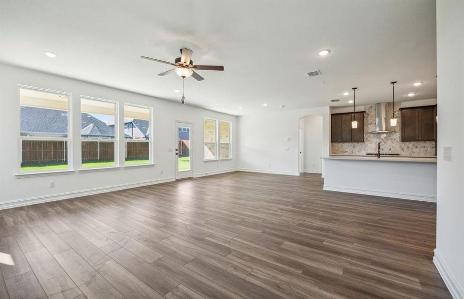 Airy gathering room with expansive windows  *real home pictured