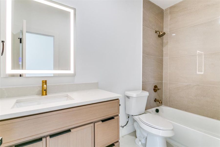 Bathroom featuring vanity and shower / bathtub combination Bathroom featuring vanity and shower / bathtub combination