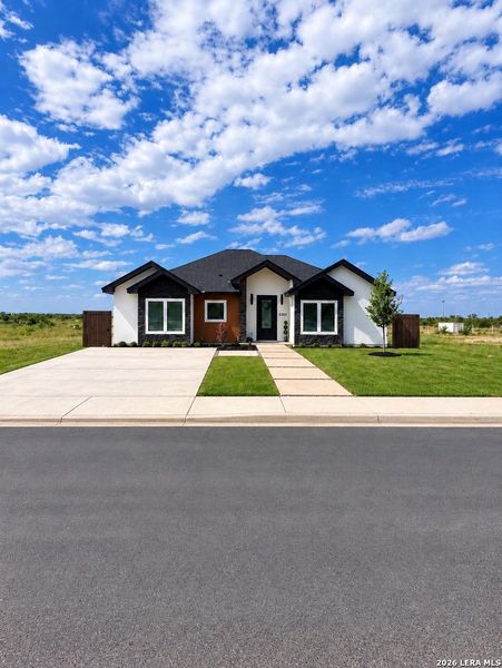 Front exterior of a new home in , Eagle Pass, TX, highlighting curb appeal (Image 27).