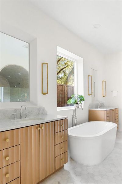 Bathroom with vanity and a tub