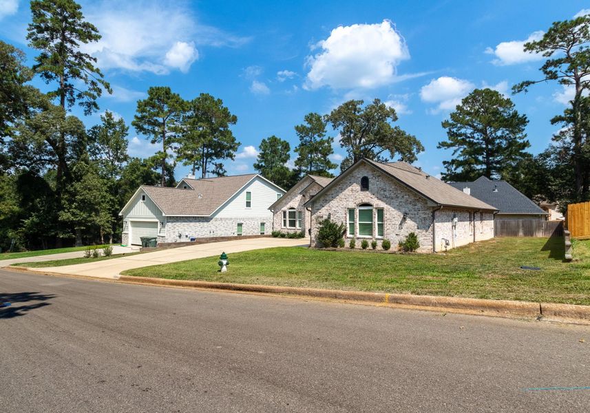 Front exterior of a new home in , Huntsville, TX, highlighting curb appeal (Image 19). Front exterior of a new home in , Huntsville, TX, highlighting curb appeal (Image 19).