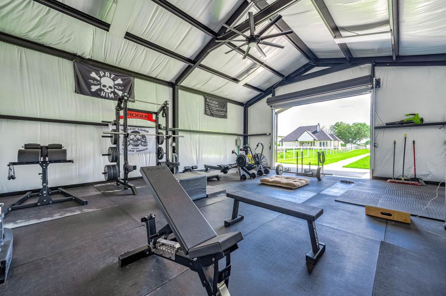 This spacious outbuilding offers an open and functional layout with high ceilings, abundant natural light, and views overlooking the backyard. The versatile space is ideal for a home gym, workshop, recreational area, or additional storage.