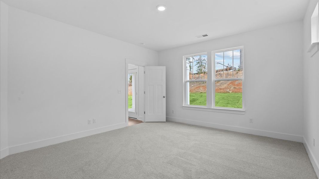 Accomplished design meets restful elegance in this exclusive primary suite by DRB Homes located in Moore, SC