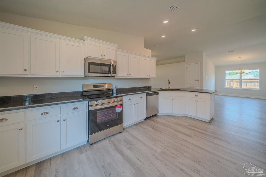 Furnished interior view inside a new home in Pine Top, Cantonment (Image 4).