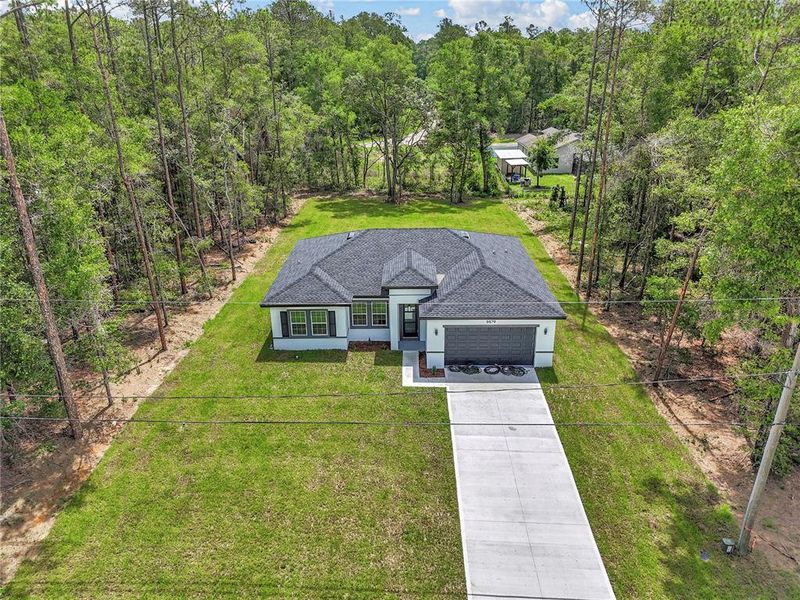 Front exterior of a new home in , Dunnellon, FL, highlighting curb appeal (Image 19).