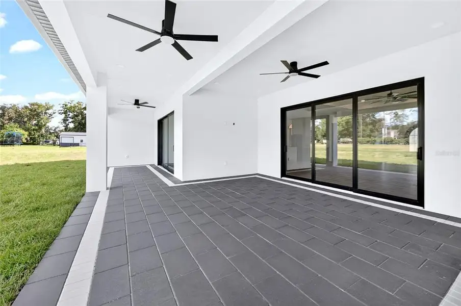 Exterior details and patio area of a home in , Dade City (Image 3).