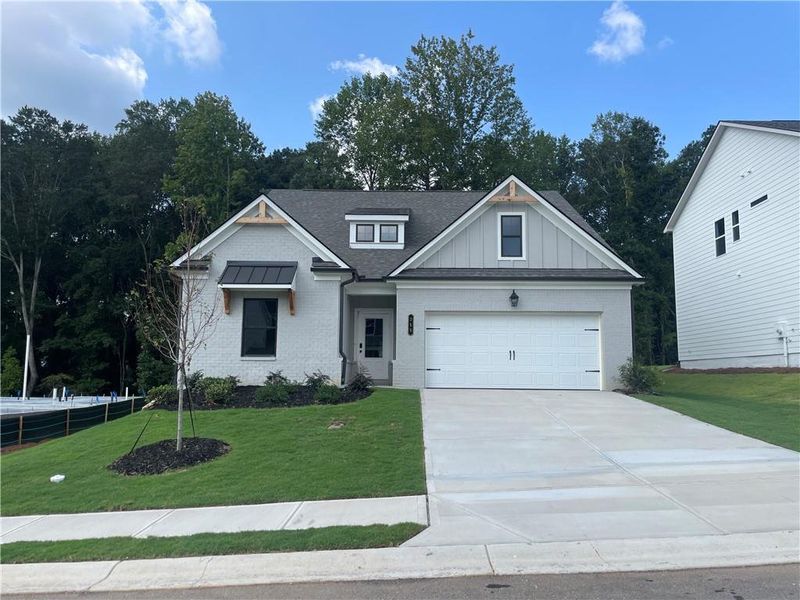 Front exterior of a new home in Summerlin, Winder, GA, highlighting curb appeal (Image 24).