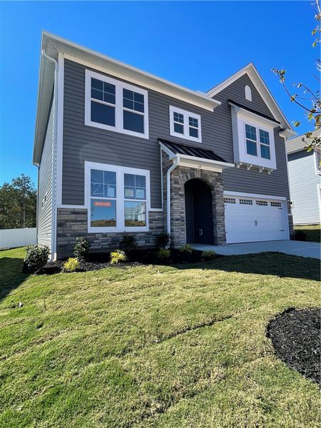 Exterior details and patio area of a home in Springwood Grove, Central (Image 2).