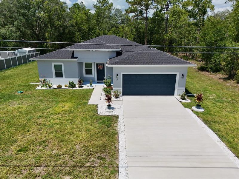 Front exterior of a new home in , Ocala, FL, highlighting curb appeal (Image 22).