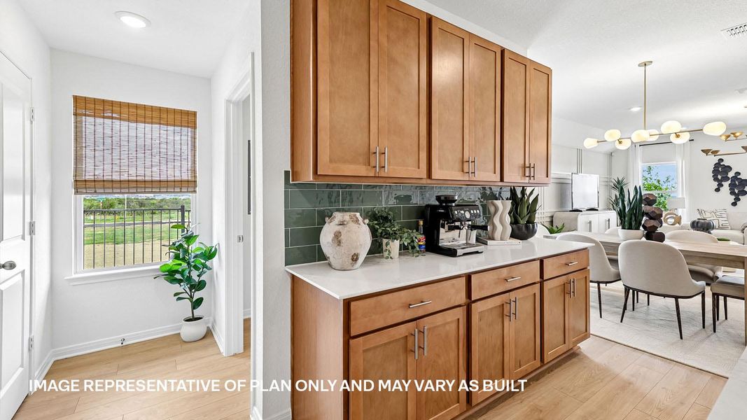 Representative furnished interior of a home built from the The Kingston by D.R. Horton in Revelry, Del Valle (Image 24).