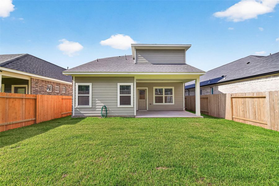 Exterior details and patio area of a home in Mill Creek Trails, Magnolia (Image 28).