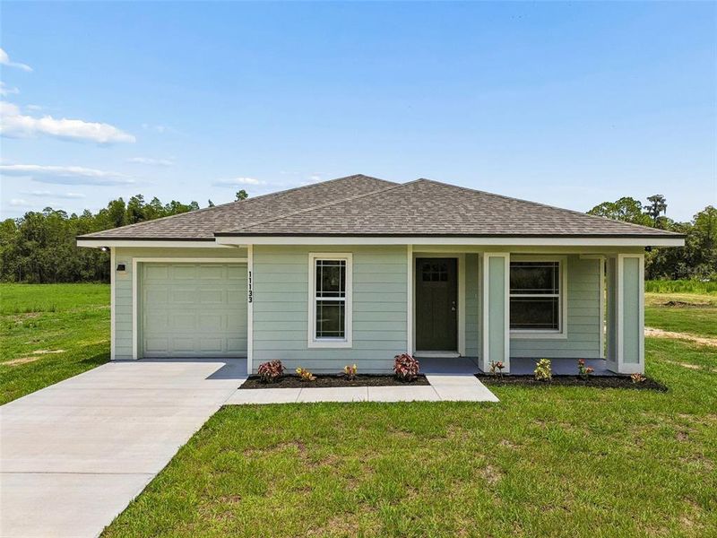 Front exterior of a new home in , Lakeland, FL, highlighting curb appeal (Image 20).