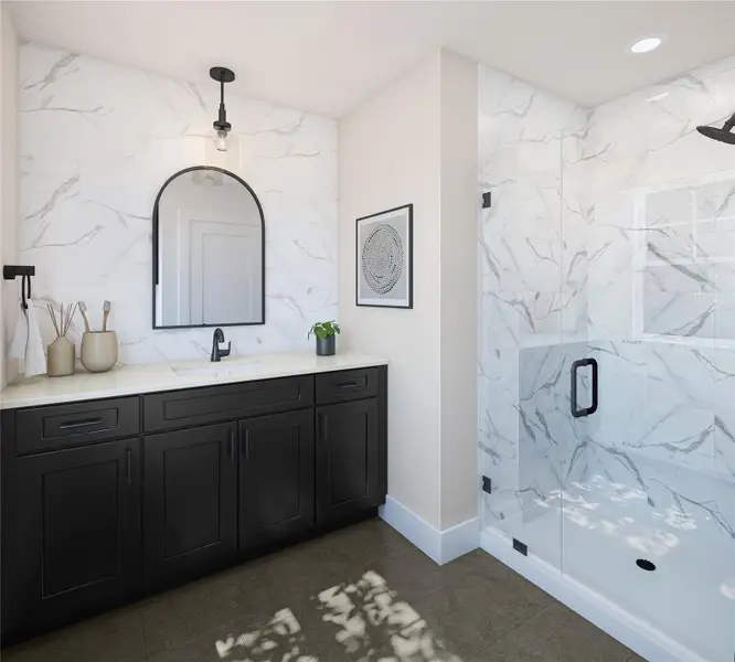 Full bathroom featuring a marble finish shower, vanity, and dark tile patterned floors Full bathroom featuring a marble finish shower, vanity, and dark tile patterned floors