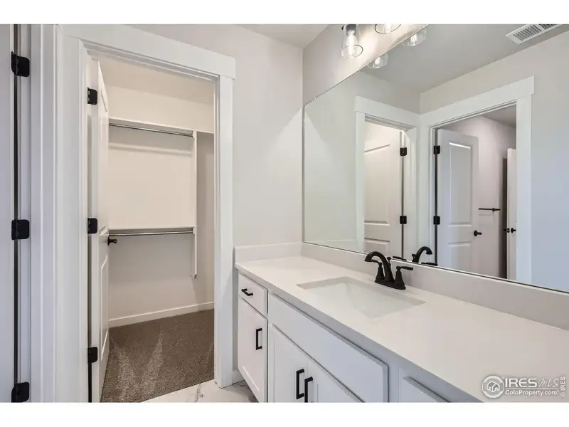 Furnished interior view inside a new home in RainDance, Windsor (Image 7).