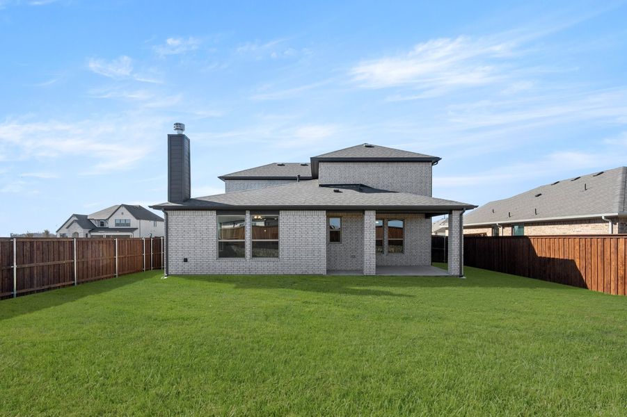 Front exterior of a new home in Myrtle Creek, Waxahachie, TX, highlighting curb appeal (Image 28). Front exterior of a new home in Myrtle Creek, Waxahachie, TX, highlighting curb appeal (Image 28).