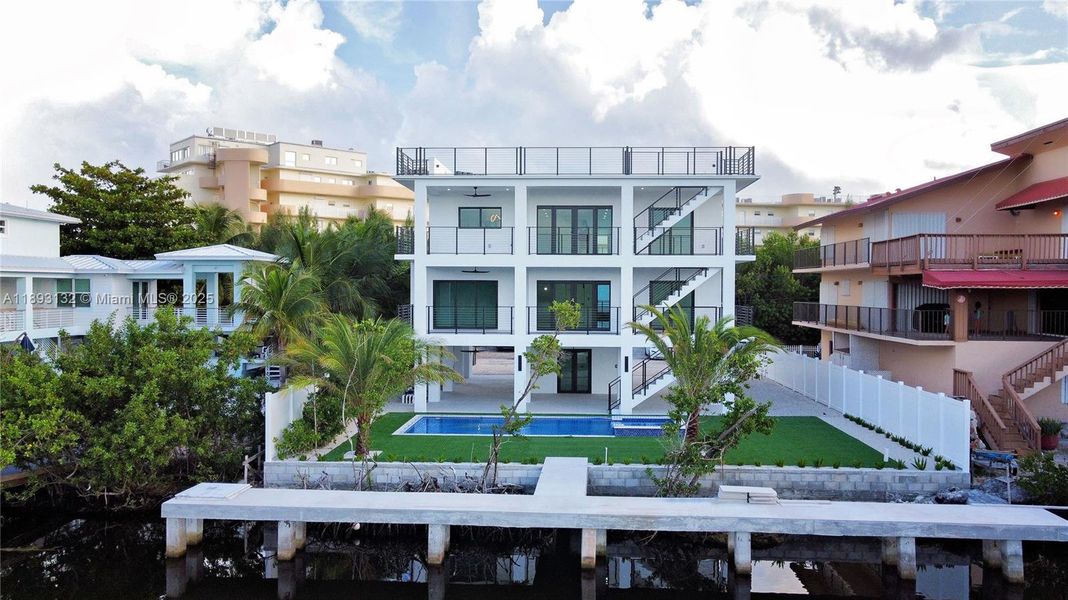 Front exterior of a new home in , Tavernier, FL, highlighting curb appeal (Image 19).