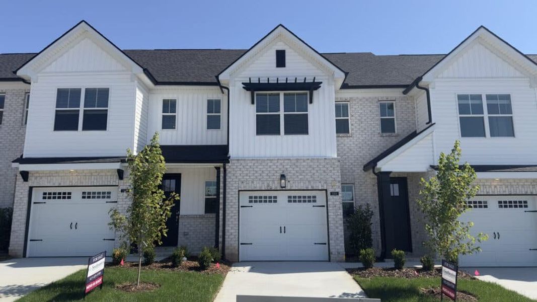 Front exterior of a new home in The Grove at Kennesaw Farms, Gallatin, TN, highlighting curb appeal (Image 1). Front exterior of a new home in The Grove at Kennesaw Farms, Gallatin, TN, highlighting curb appeal (Image 1).