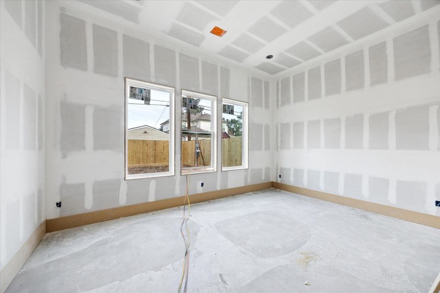 Positioned on the first floor, this bedroom features a well proportioned layout with multiple windows that bring in natural light. Its location and size make it perfectly suited for a guest suite, gym or additional office space.