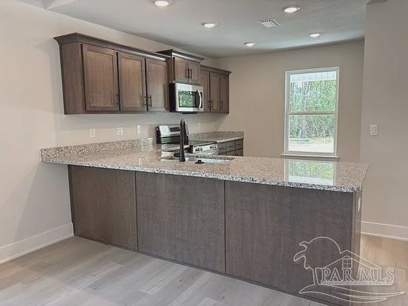 Furnished interior view inside a new home in Turtle Creek, Cantonment (Image 6).