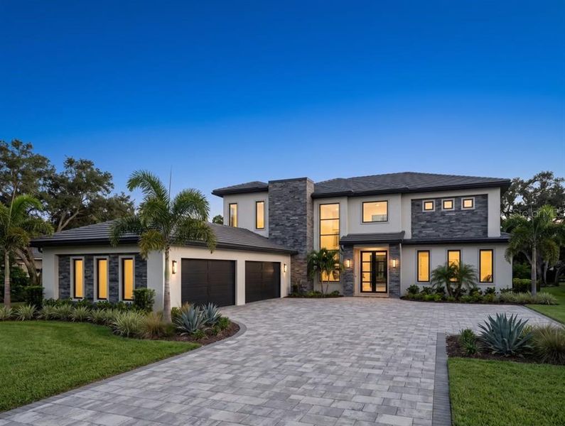 Front exterior of a new home in , Montverde, FL, highlighting curb appeal (Image 3).