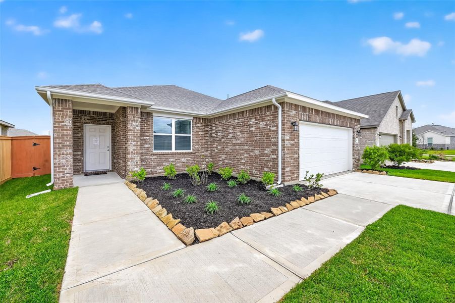 Front exterior of a new home in Cypress Green, Hockley, TX, highlighting curb appeal (Image 22). Front exterior of a new home in Cypress Green, Hockley, TX, highlighting curb appeal (Image 22).