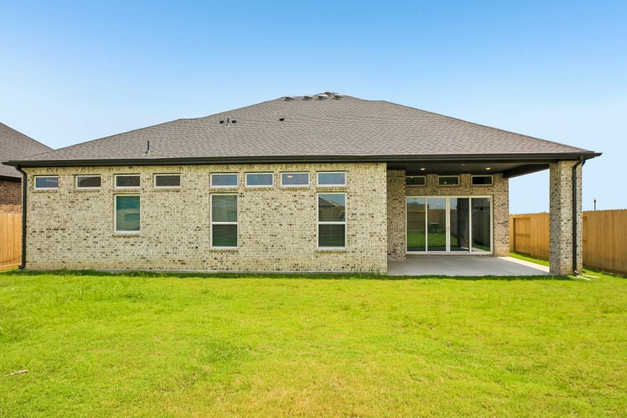 Exterior details and patio area of a home in Riceland 60',65',70', Old River-Winfree (Image 25).