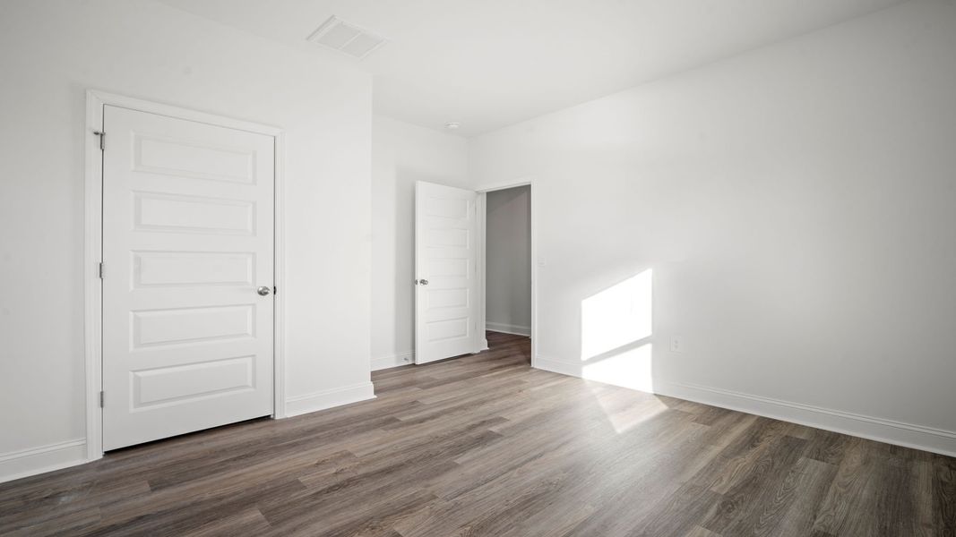 Representative unfurnished interior of a home built from the Hemingway-Exp by D.R. Horton in The Lakes at North Glynn, Brunswick (Image 24).