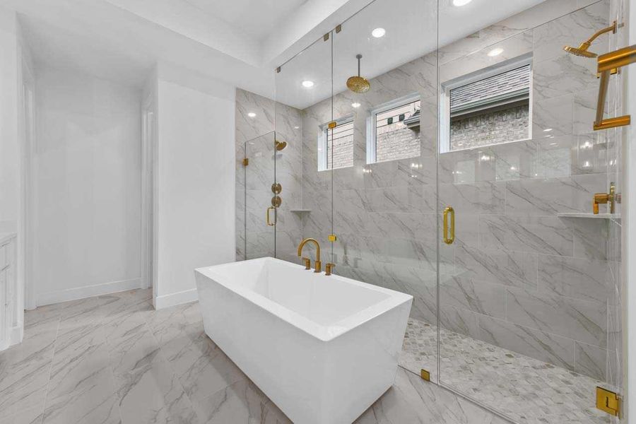 Bathroom featuring separate shower and tub