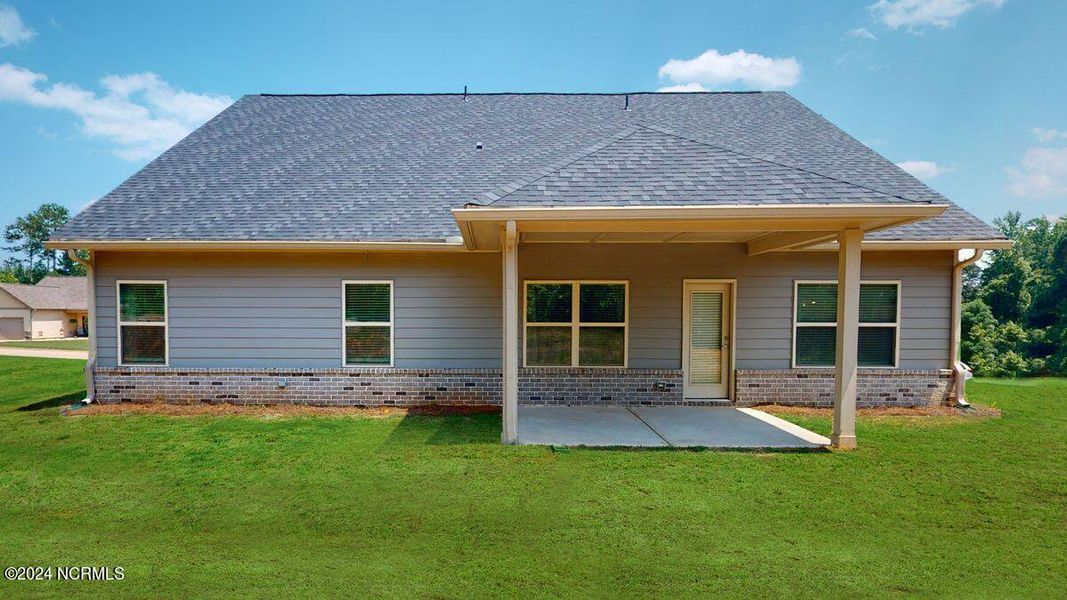 Exterior details and patio area of a home in River Village Square in River Landing, Wallace (Image 3).