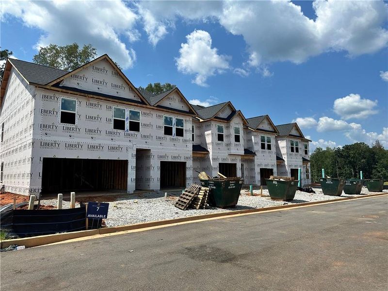 Front exterior of a new home in Carolina, Palmetto, GA, highlighting curb appeal (Image 1).