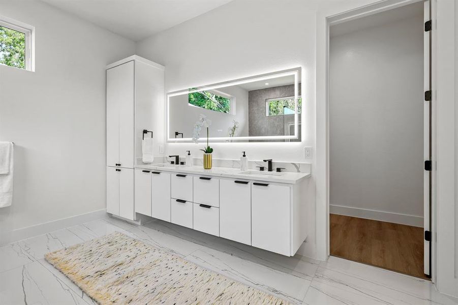 Bathroom with double sink vanity and wood-type flooring