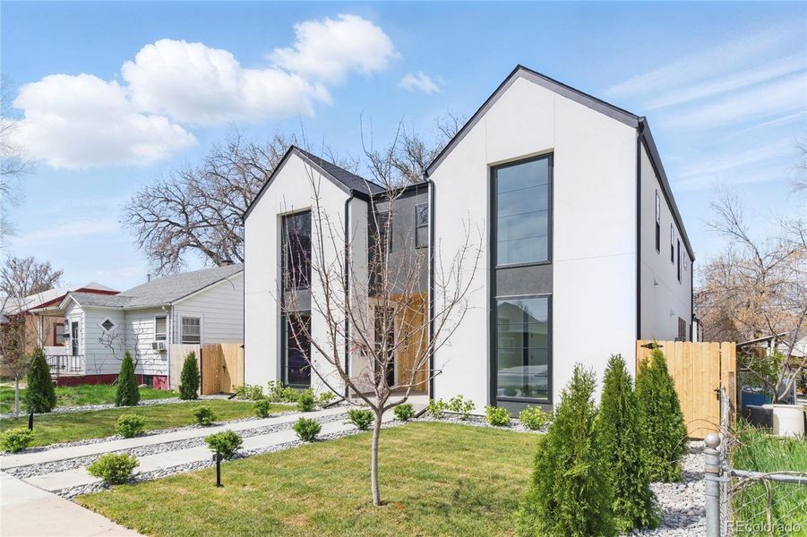 Front exterior of a new home in , Englewood, CO, highlighting curb appeal (Image 30).