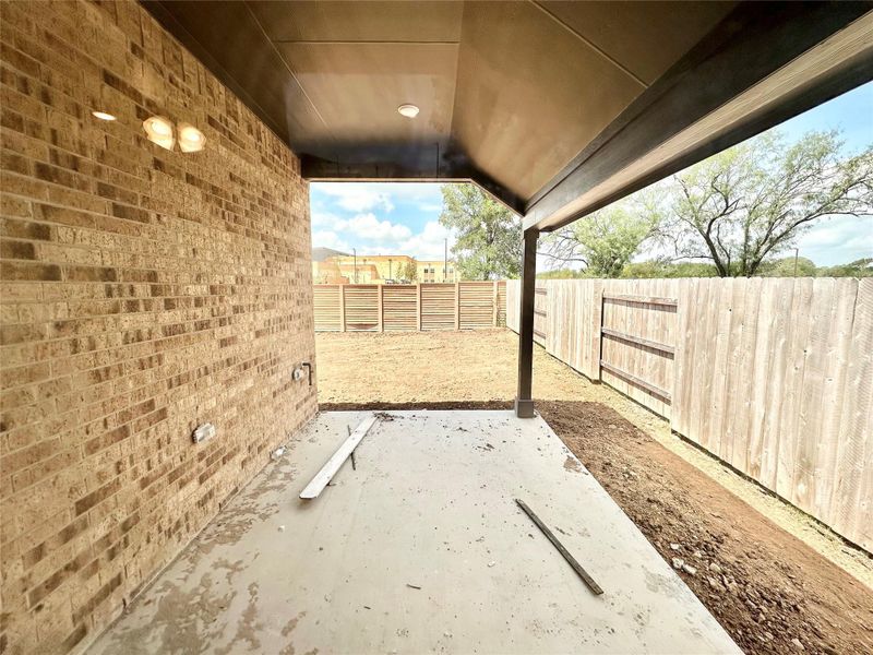 Fenced backyard featuring a patio area Fenced backyard featuring a patio area