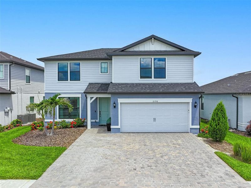 Front exterior of a new home in , North Port, FL, highlighting curb appeal (Image 20).