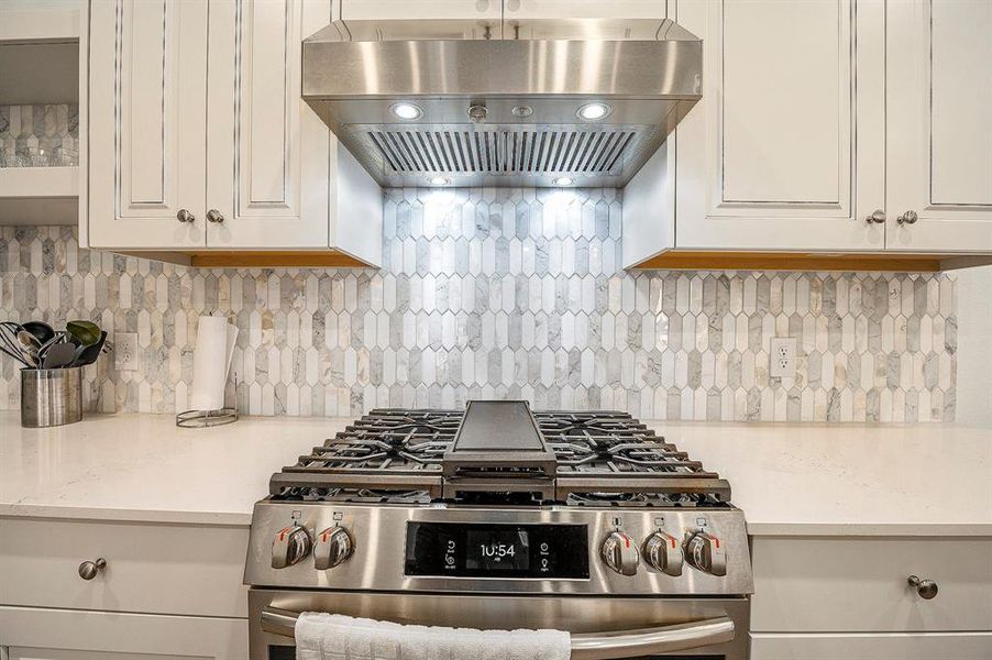 This kitchen features upgrades galore, including the cabinets and backsplash just to name a few.