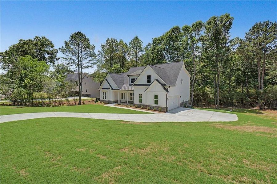 Front exterior of a new home in , Rome, GA, highlighting curb appeal (Image 23).